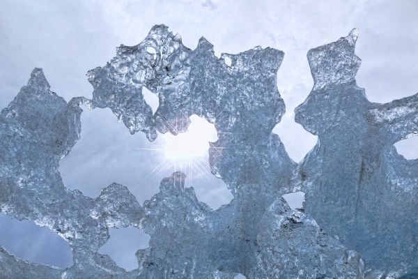 AK Sun shining through ice of McBride Glacier